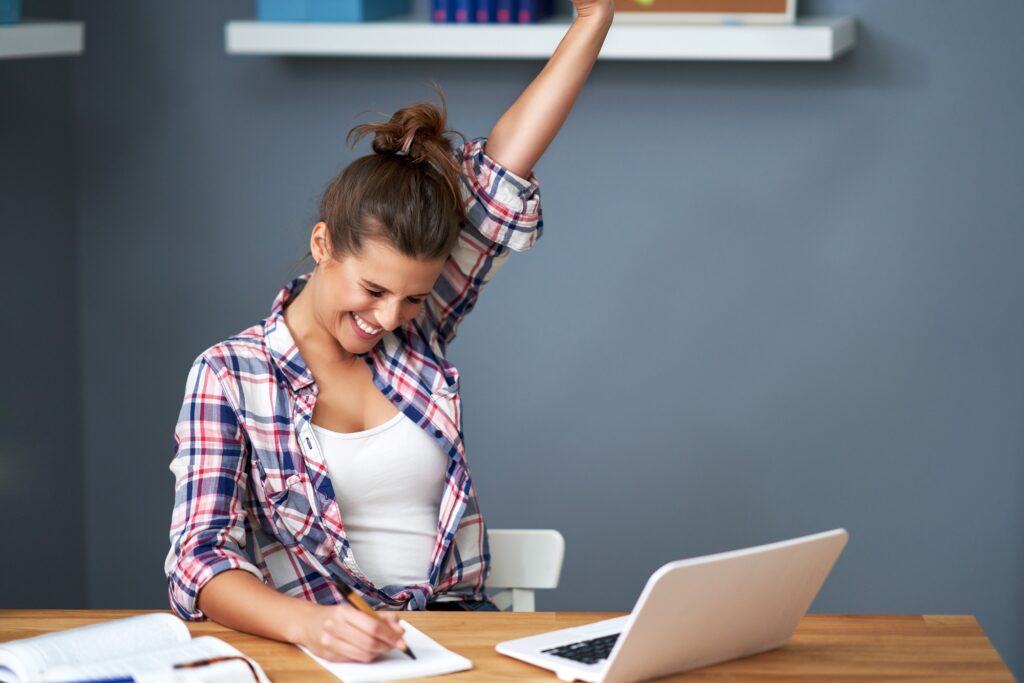 Successful female student learning at home